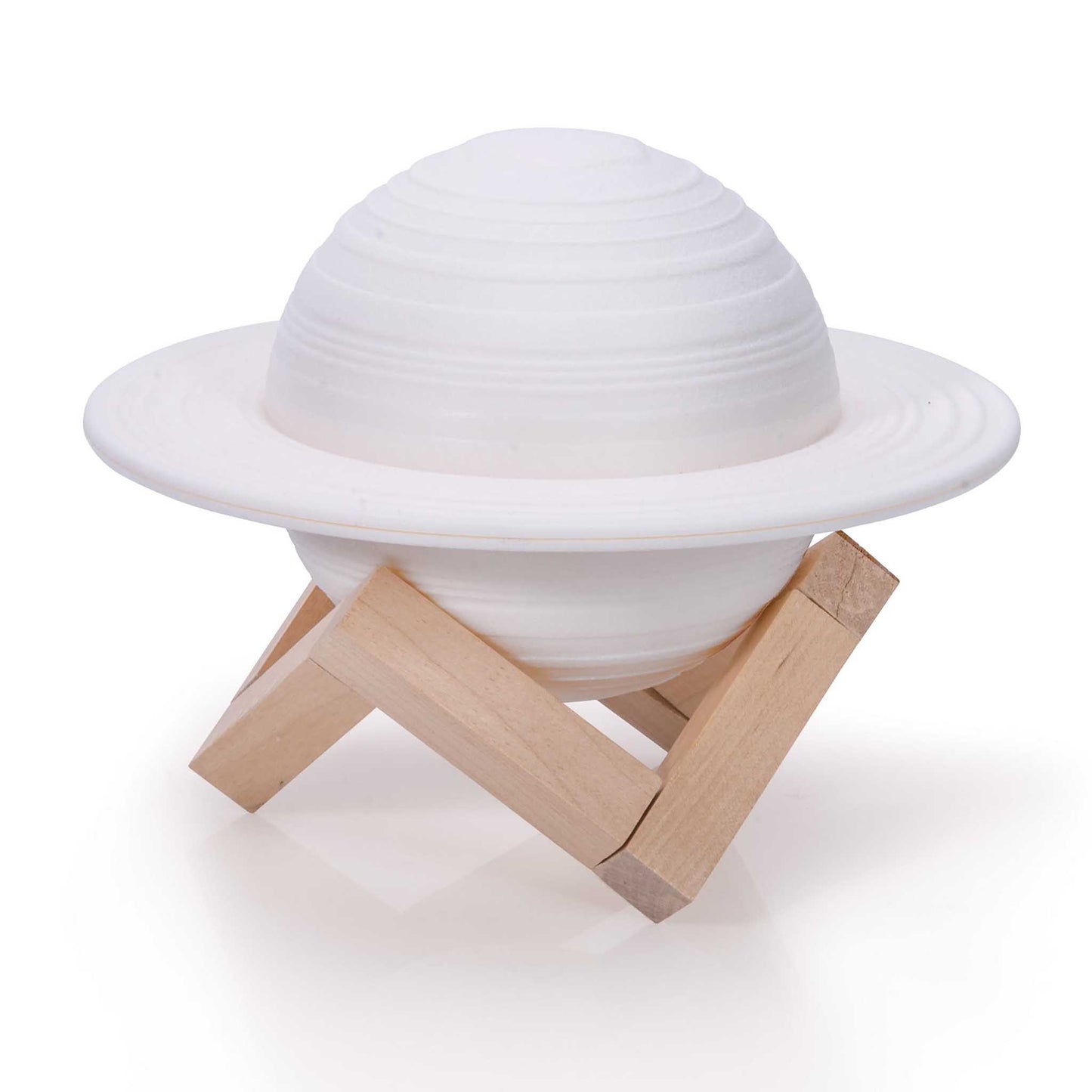 White UFO-shaped object on a wooden stand against a white background