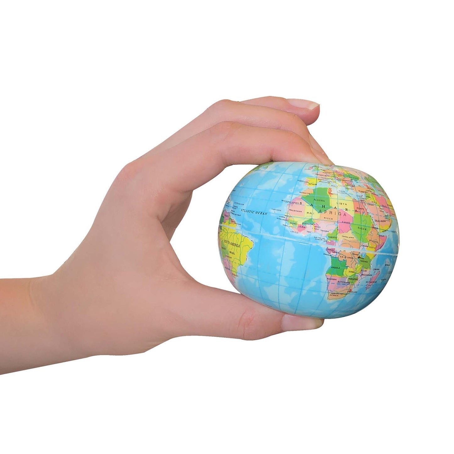 Hand holding a small globe stress ball against a white background