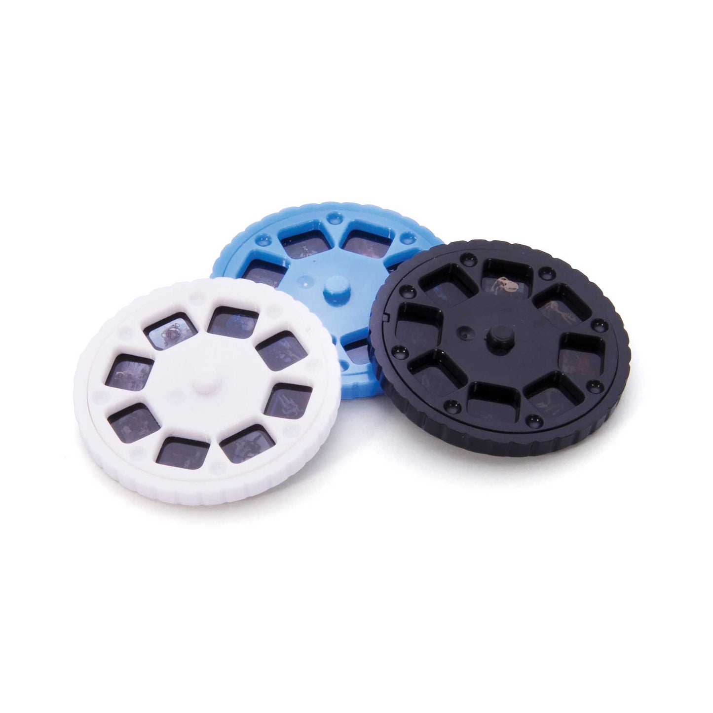 Three circular plastic filters in white, blue, and black on a white background