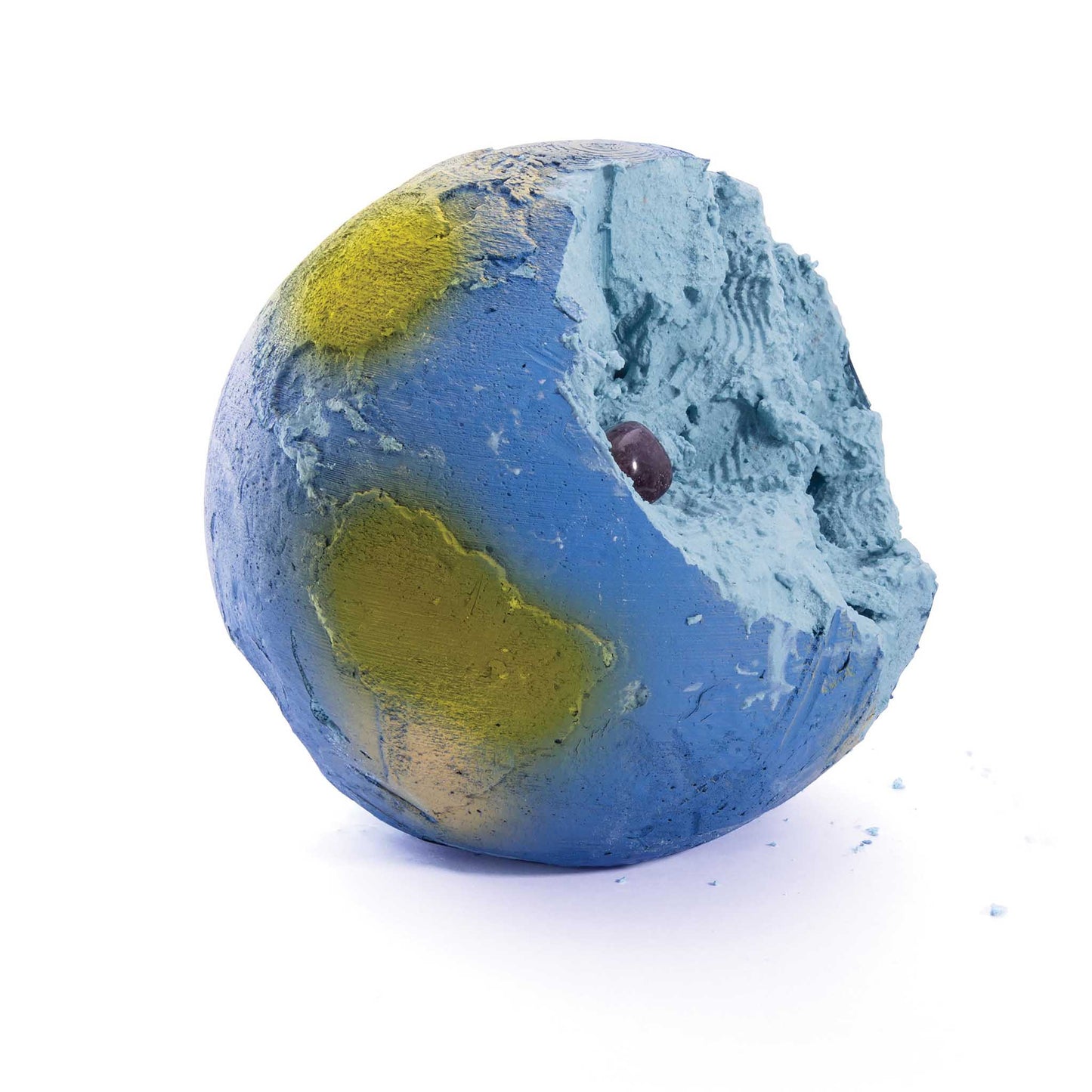 Blue and green globe, partially dug through, on a white background