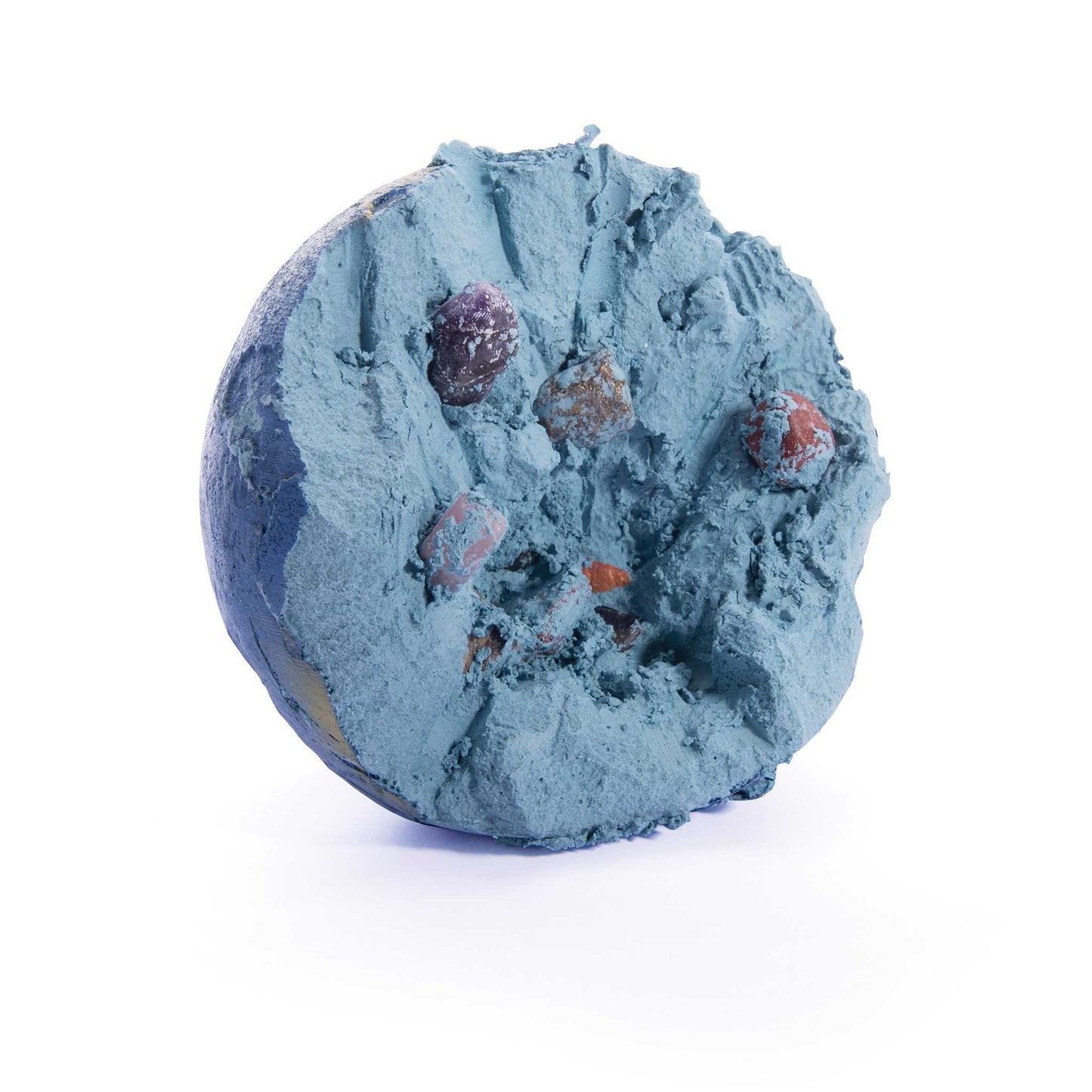 half dug globe with natural elements being revealed on the inside, on a white background