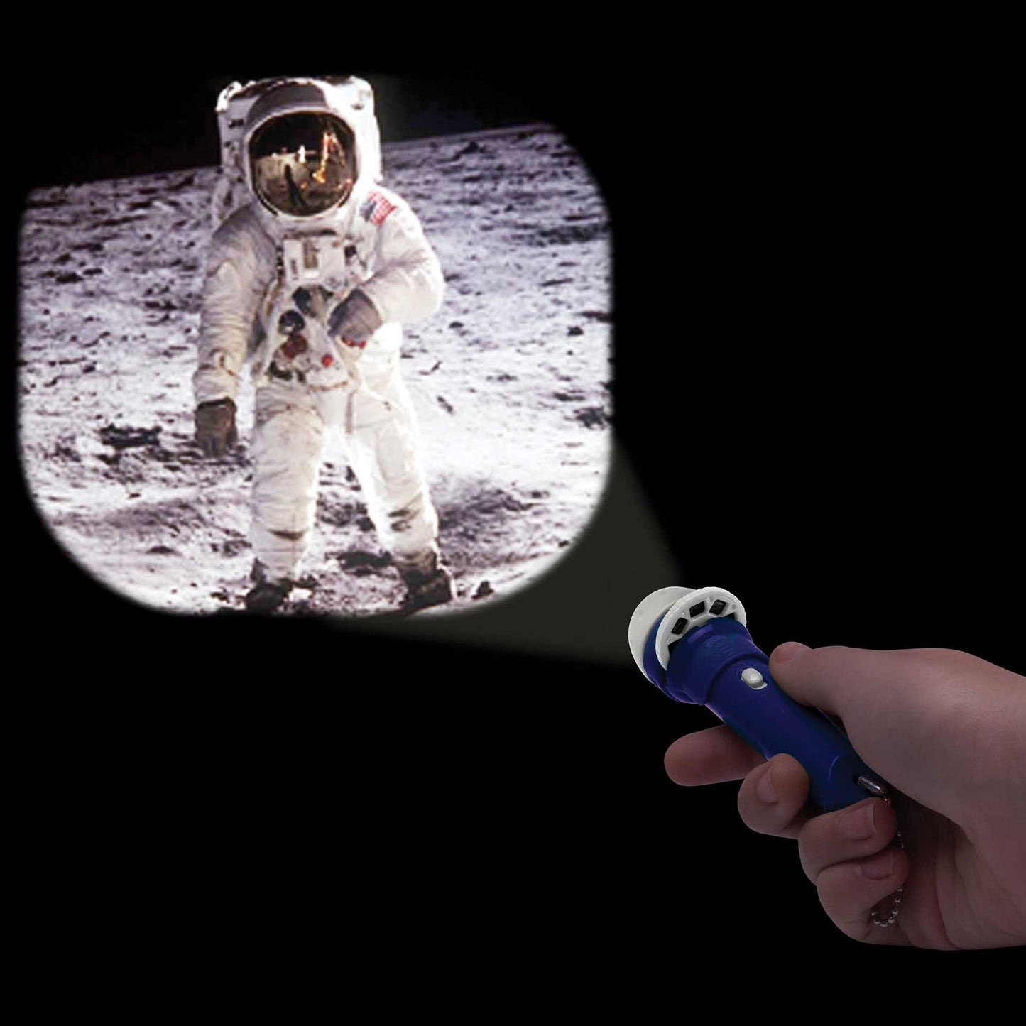 Hand holding a flashlight projecting an image of an astronaut on the moon.