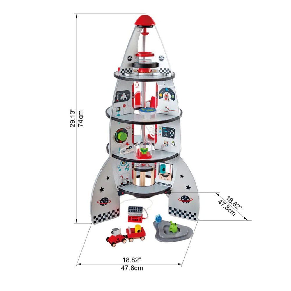 Toy rocket ship with various compartments and toys on a white background, including dimensions.