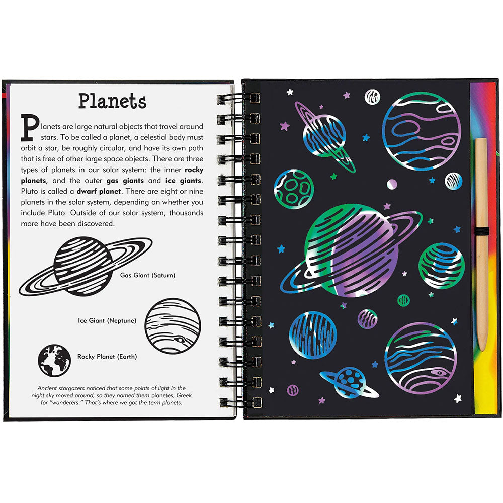 Open notebook with space-themed pages including illustrations of planets and text about planets.