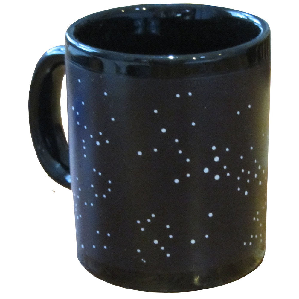 Black mug with white speckles on a white background