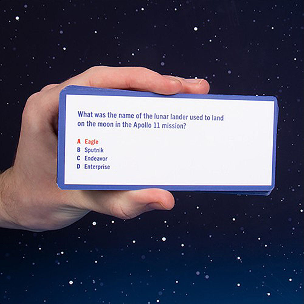 Hand holding a device with a question on a space-themed background