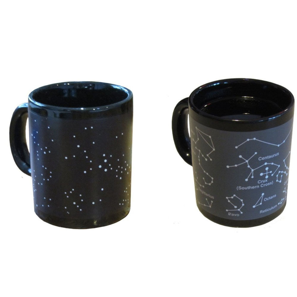 Two black mugs, one with star pattern and the other with constellation design, on a white background.