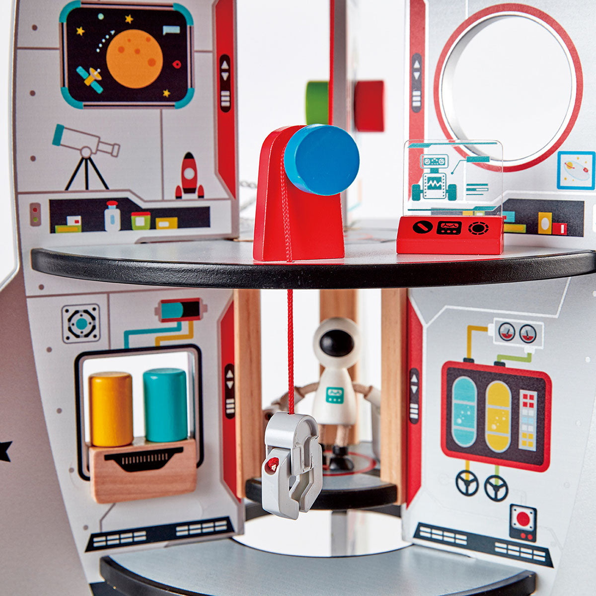 Children's toy space station with various modules and a robot figure on a white background