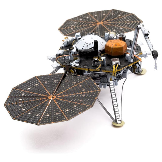Model of a space probe with solar panels on a white background