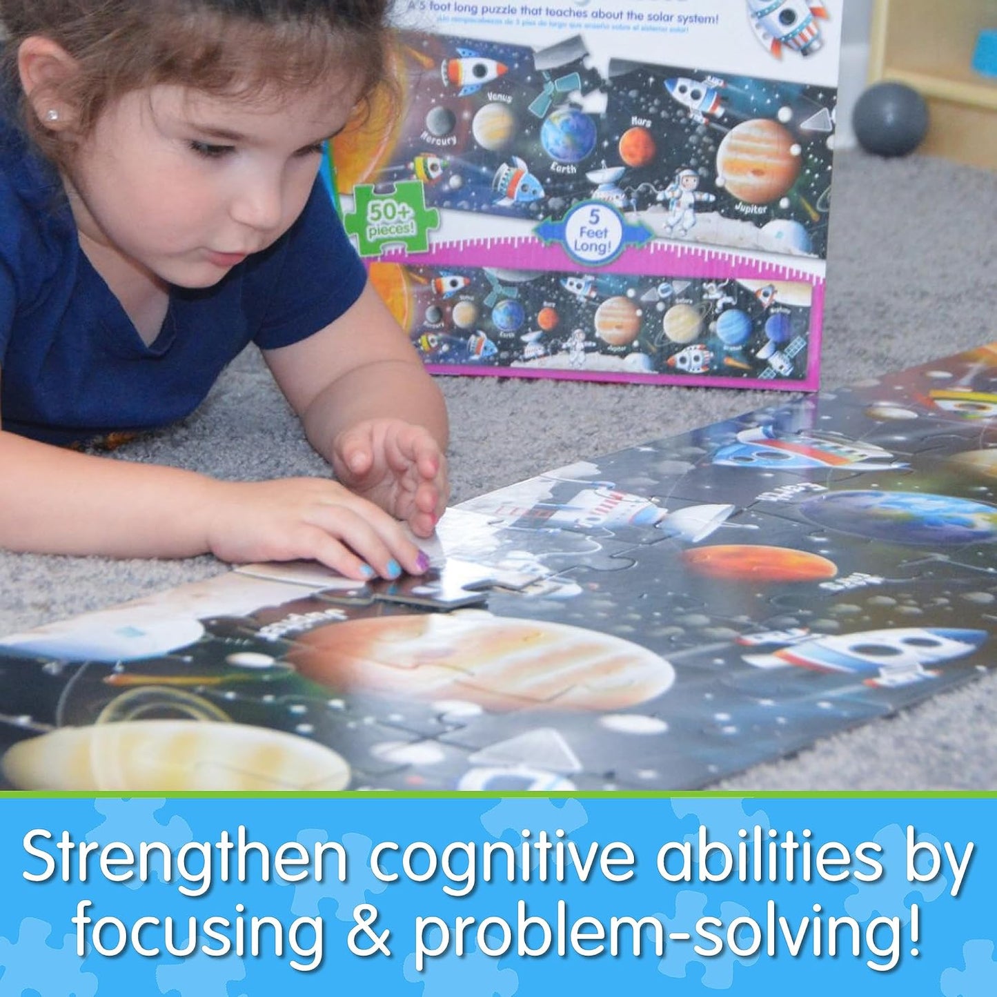 Child playing with a space-themed puzzle on the floor