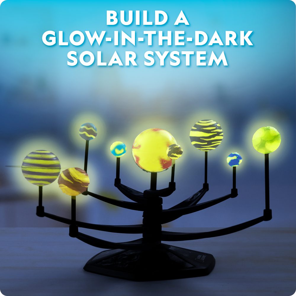 Glow-in-the-dark solar system model with text 'Build a Glow-in-the-Dark Solar System' on a dark background