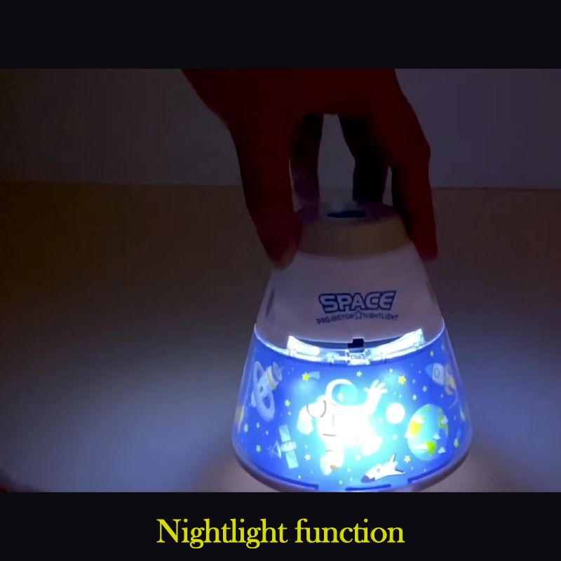 Hand holding a nightlight with 'SPACE' branding and glowing blue light.