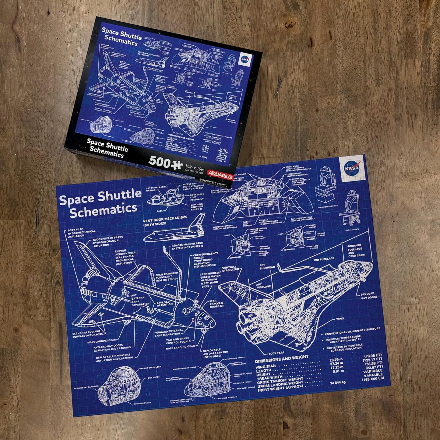 Space shuttle schematics puzzle with packaging on a wooden surface