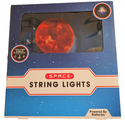 Box of space-themed string lights with a red celestial object on a blue background