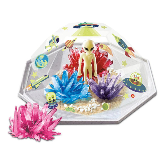 Toy set with alien figure and colorful crystals on a white background