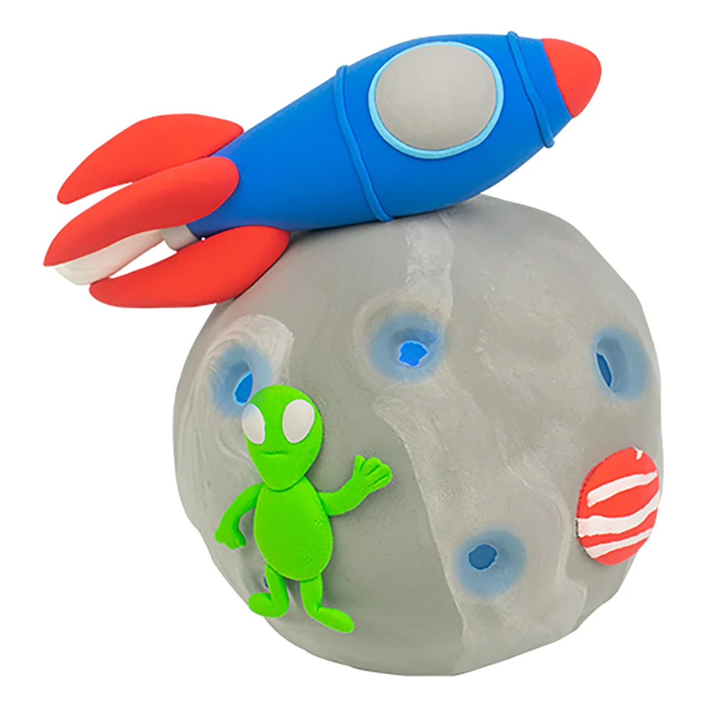 Toy rocket on a rock with an alien figure, on a white background