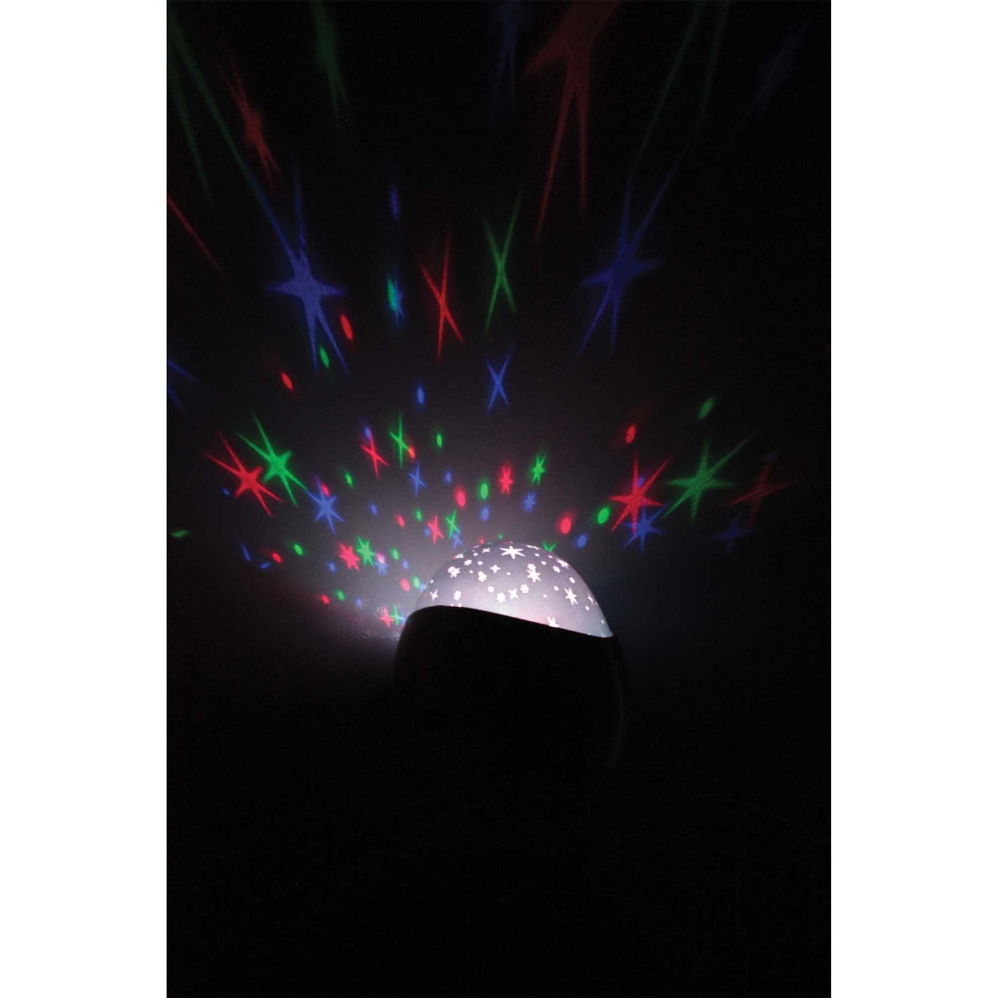 Starlight projector emitting colorful star patterns in a dark room