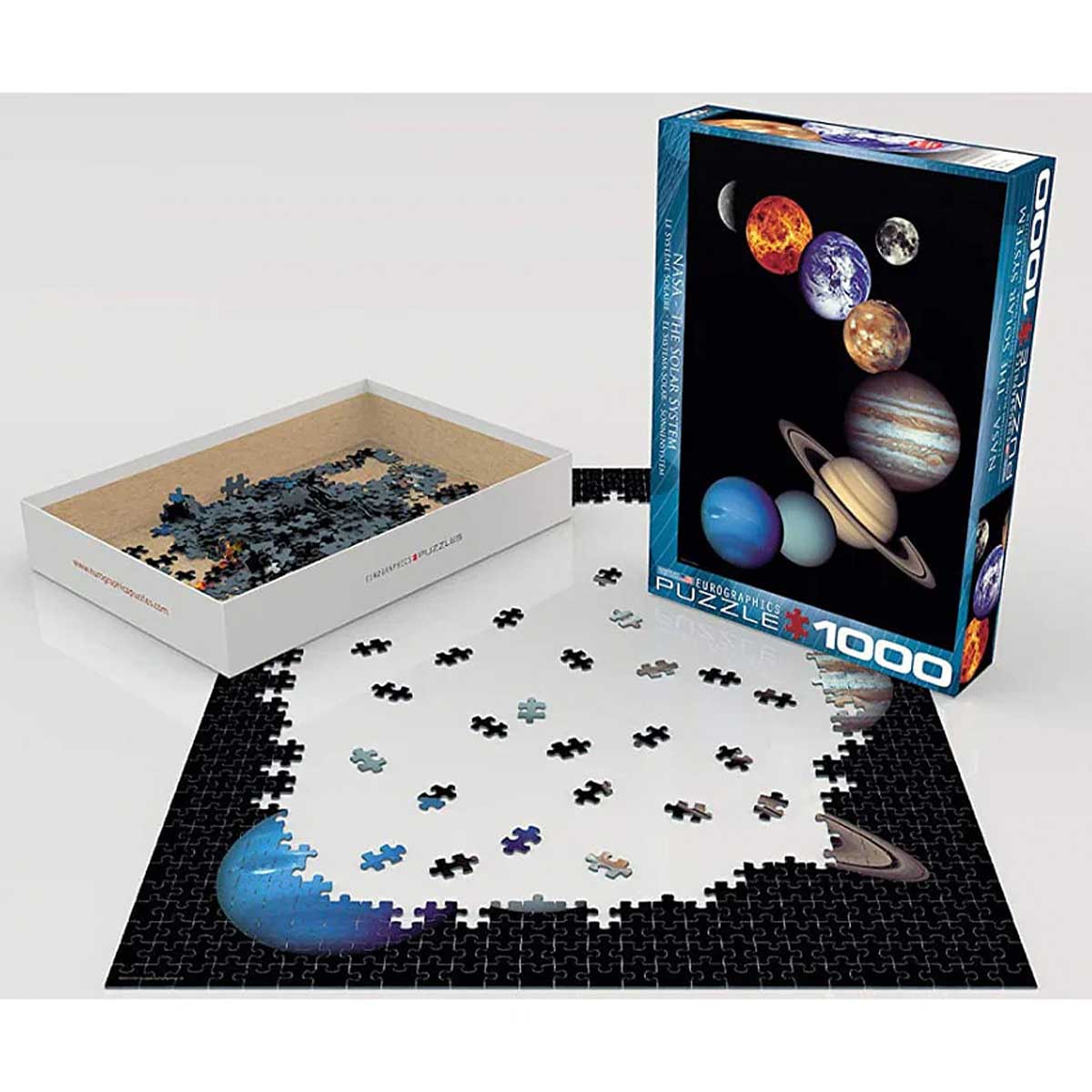 Jigsaw puzzle set with space-themed packaging and missing pieces on a white background