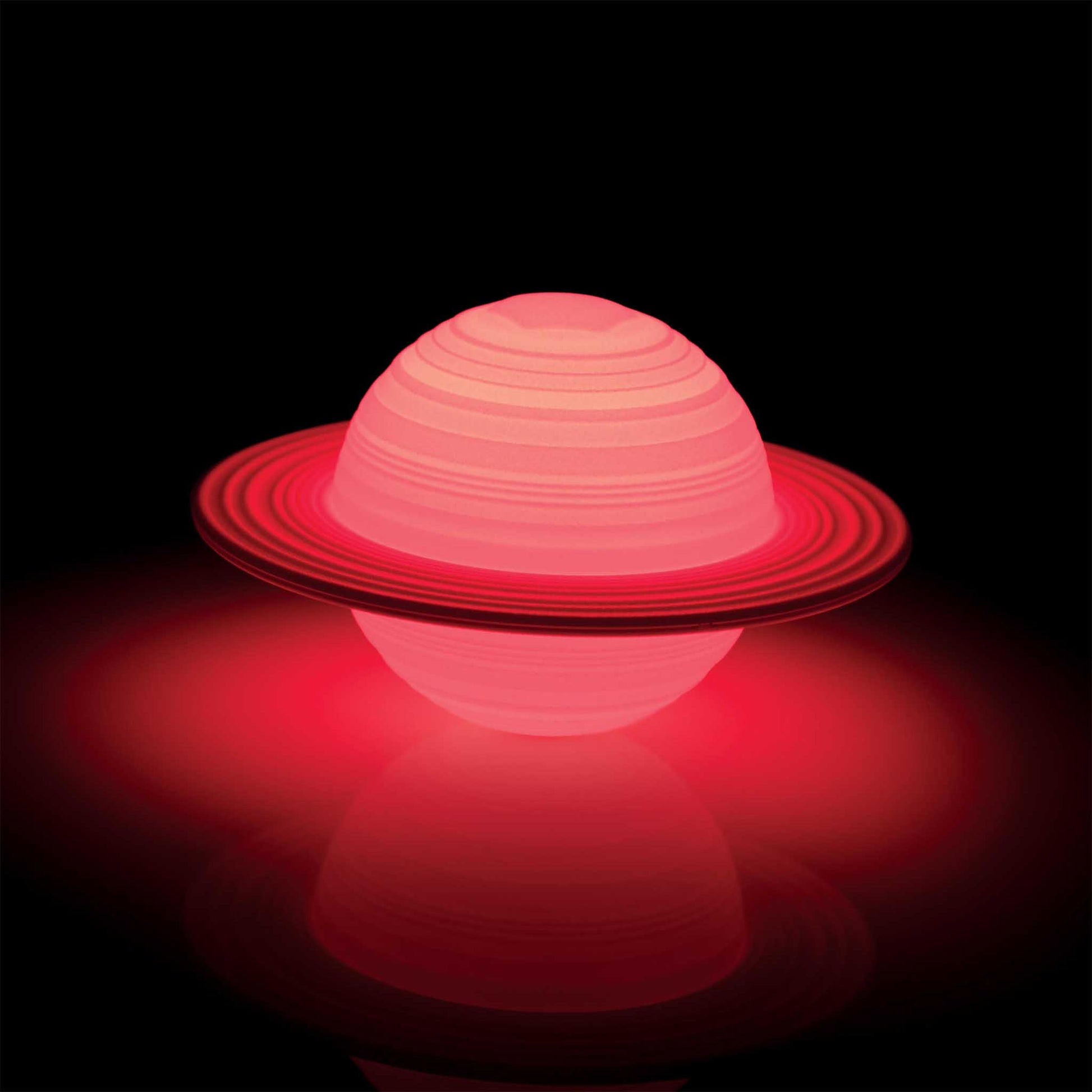 Red spherical object with concentric rings on a black background