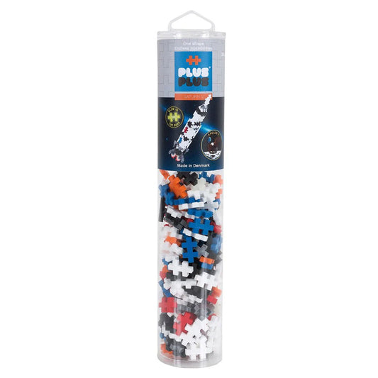 Tube of Plus-Plus building blocks with colorful blocks inside on a white background