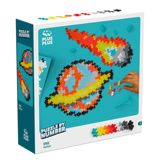 Plus Plus space-themed puzzle packaging with colorful pieces and a hand interacting with them.