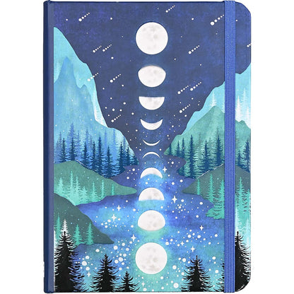 Notebook with a design of mountains, trees, and moon phases on the cover.
