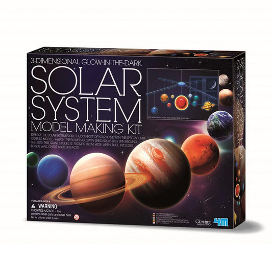 Solar system model making kit packaging with glowing planets on a dark background