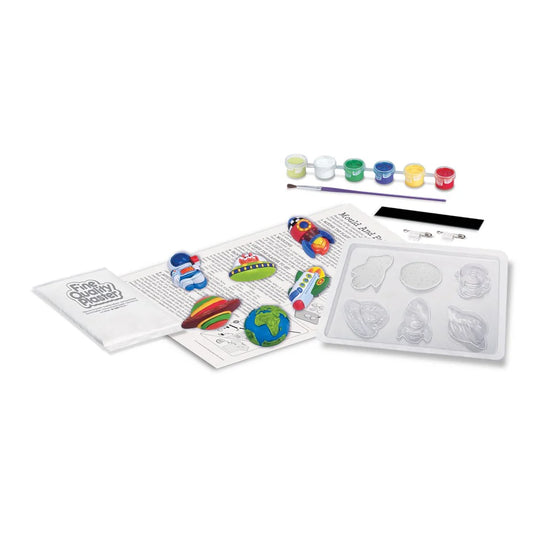 Children's craft kit with moldable material, paint, and instructions on a white background