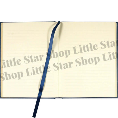 Open notebook with a blue ribbon on a white background, featuring 'Little Star Shop Little Star Shop Little'.