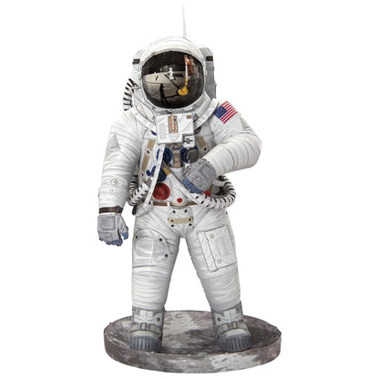 Statue of an astronaut in a white spacesuit with a helmet on a white background