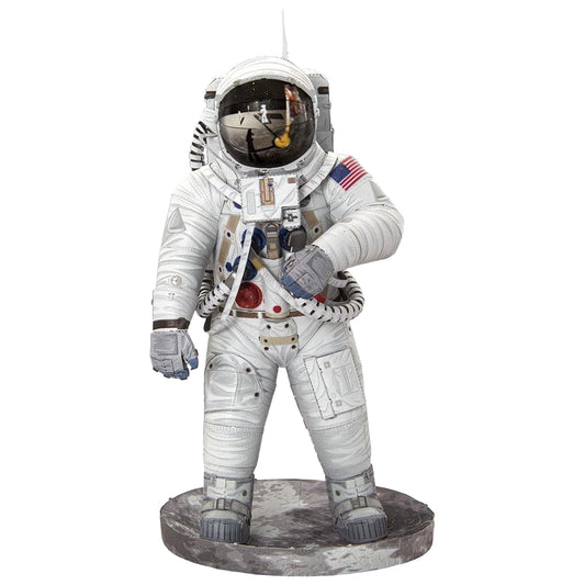 Statue of an astronaut in a white spacesuit with a helmet on a white background