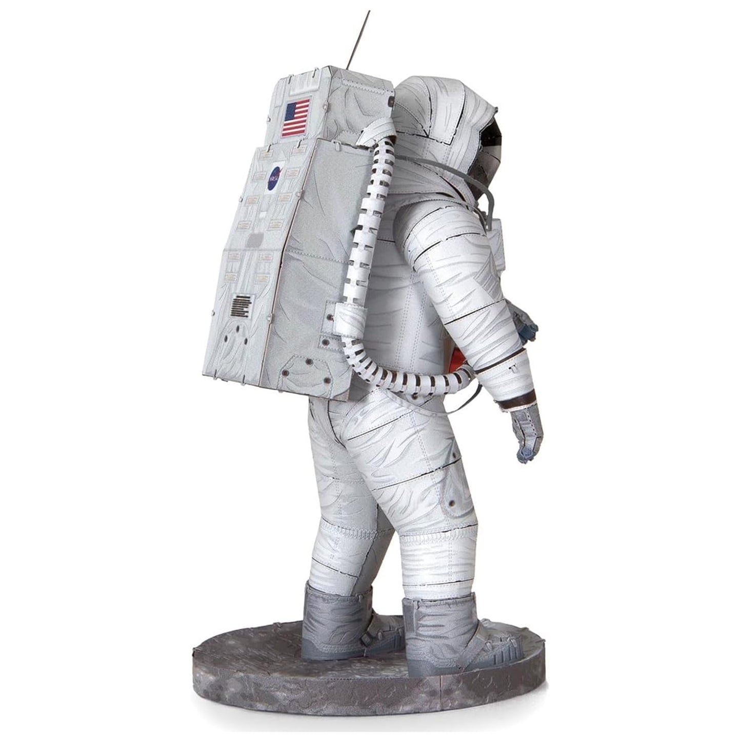 Statue of an astronaut in a space suit with an American flag patch on a white background