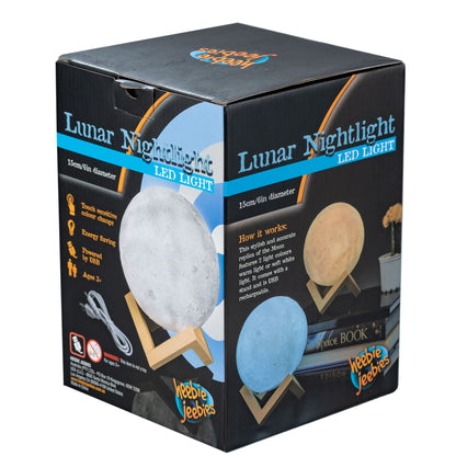 Boxed lunar nightlight with images of moon phases and text on a white background