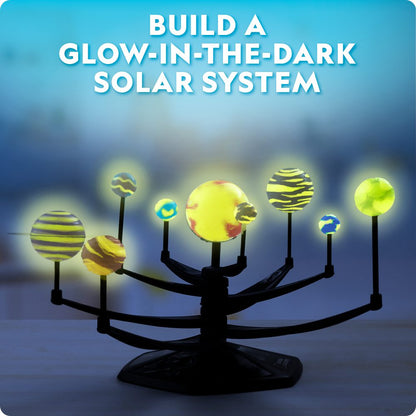 Glow-in-the-dark solar system model with text 'Build a Glow-in-the-Dark Solar System' on a dark background