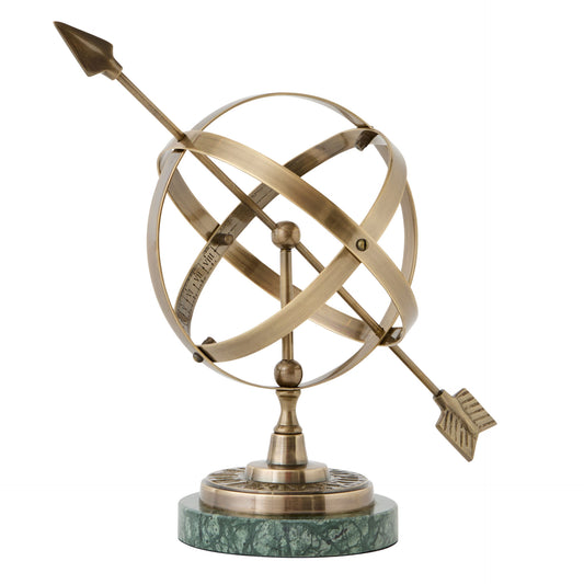 Decorative brass armillary sphere on a white background