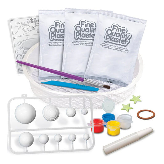 Plaster casting kit with bags, tools, and molds on a white background
