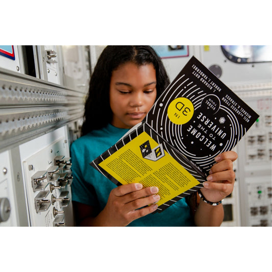 Person holding a book titled '30 Minutes to Mars' in a space-themed setting
