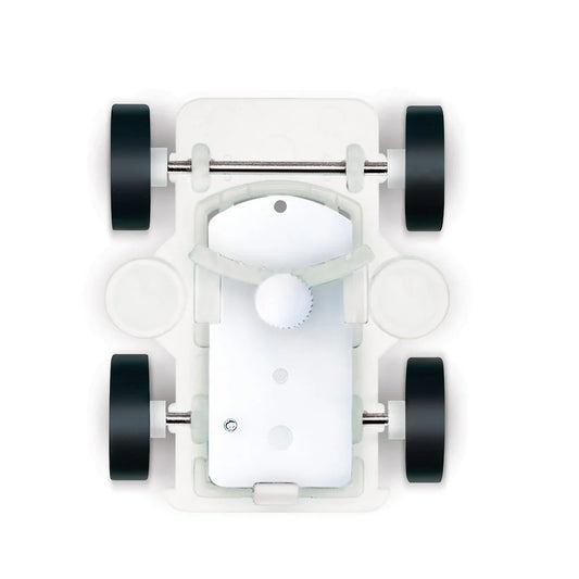 Top-down view of a white toy car chassis with black wheels on a white background