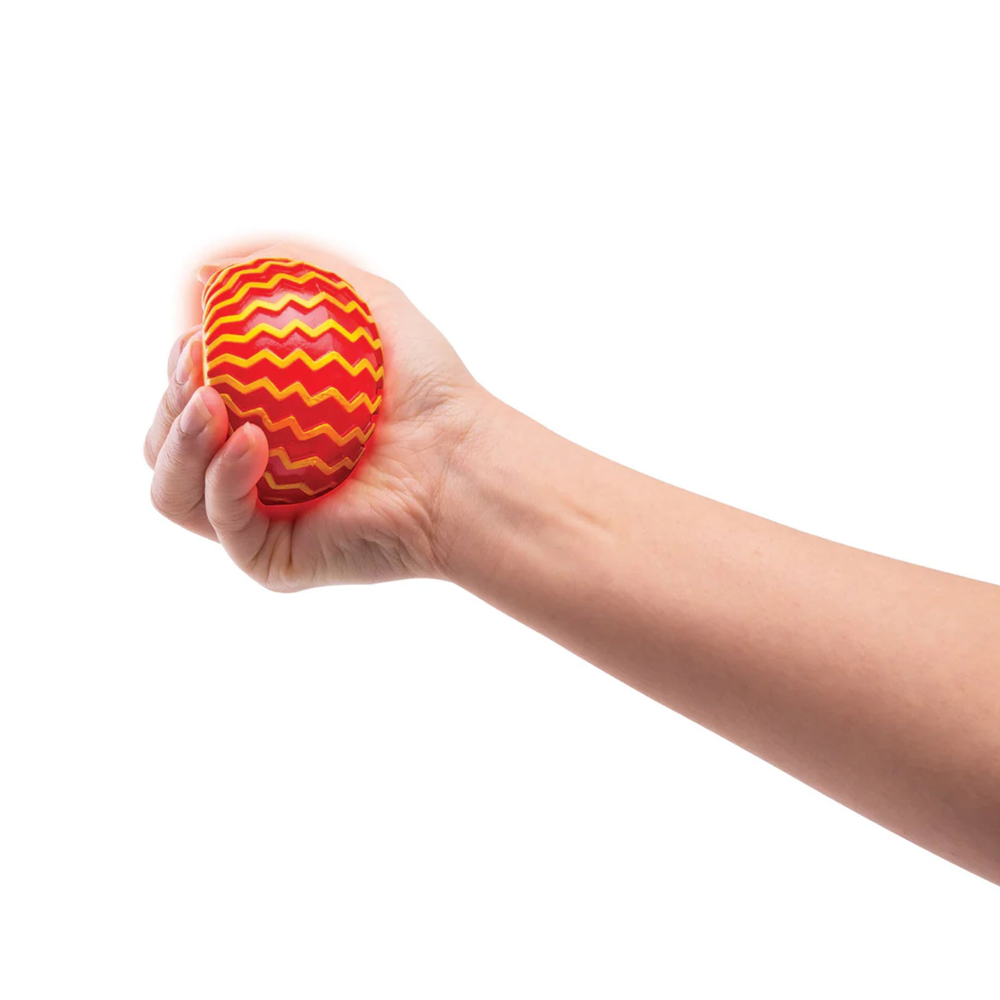 Hand holding a red and yellow textured ball against a white background