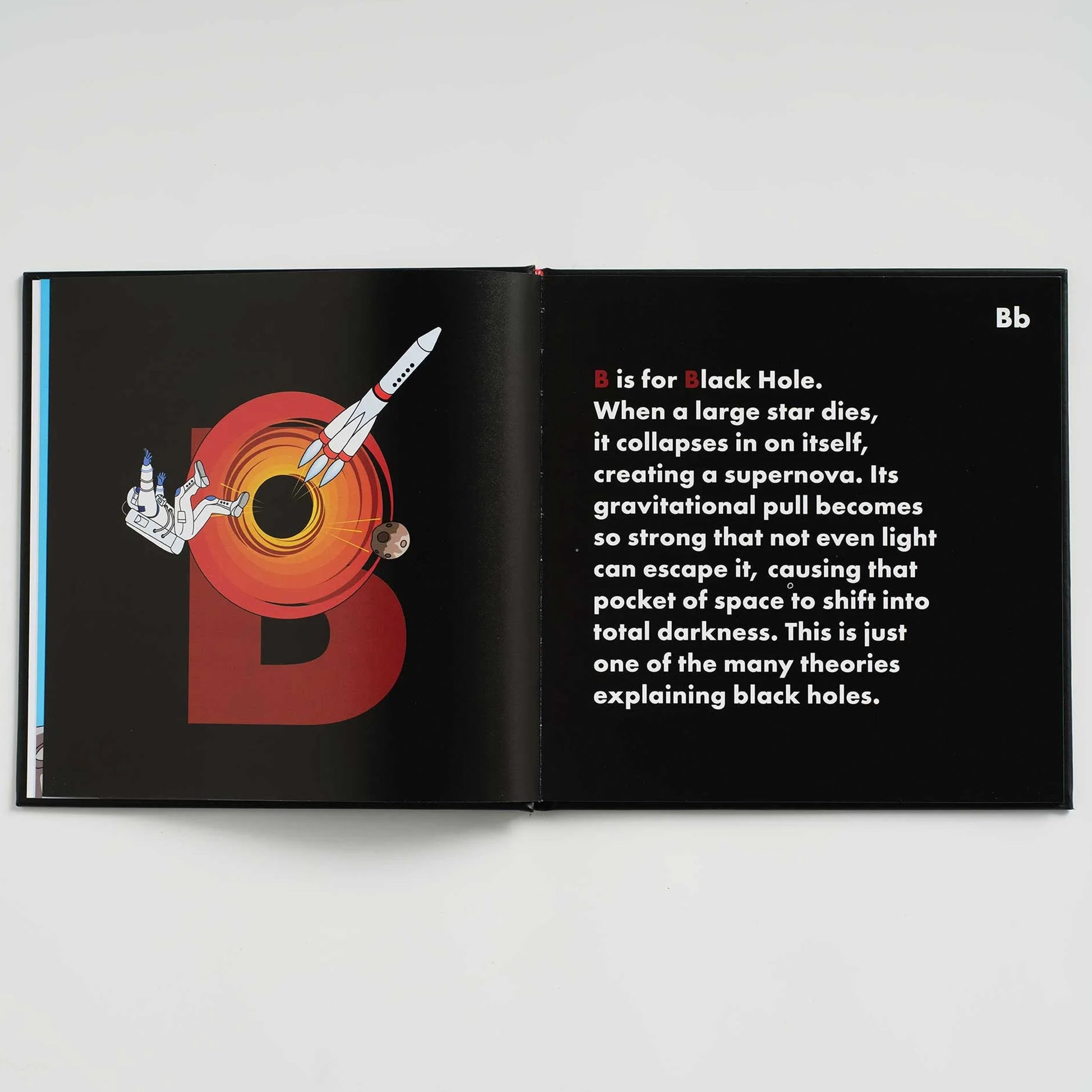 Open book with a black hole illustration and text on a white background