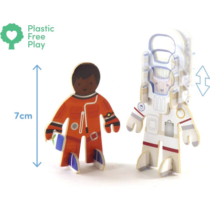 Two cardboard astronaut figures, one in an orange suit and the other in a white suit with a helmet, on a white background.