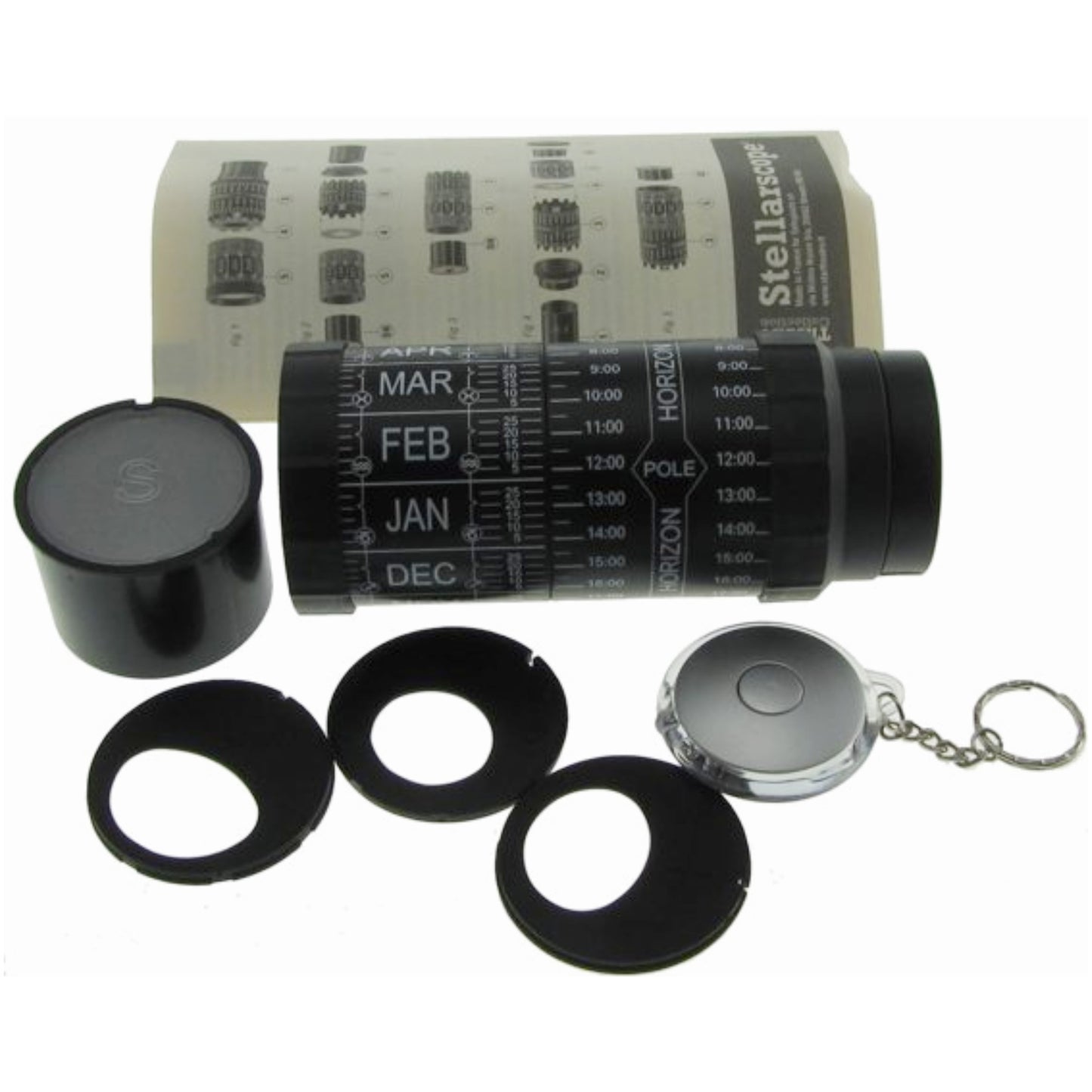 Set of astronomical tools including a cylindrical device with calendar markings, small black rings, and a keychain component on a white background.