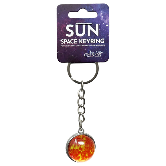 A sun space keyring with a detailed orange and yellow solar ball charm, attached to a silver metal keyring and hanging from a purple galaxy-themed retail card.